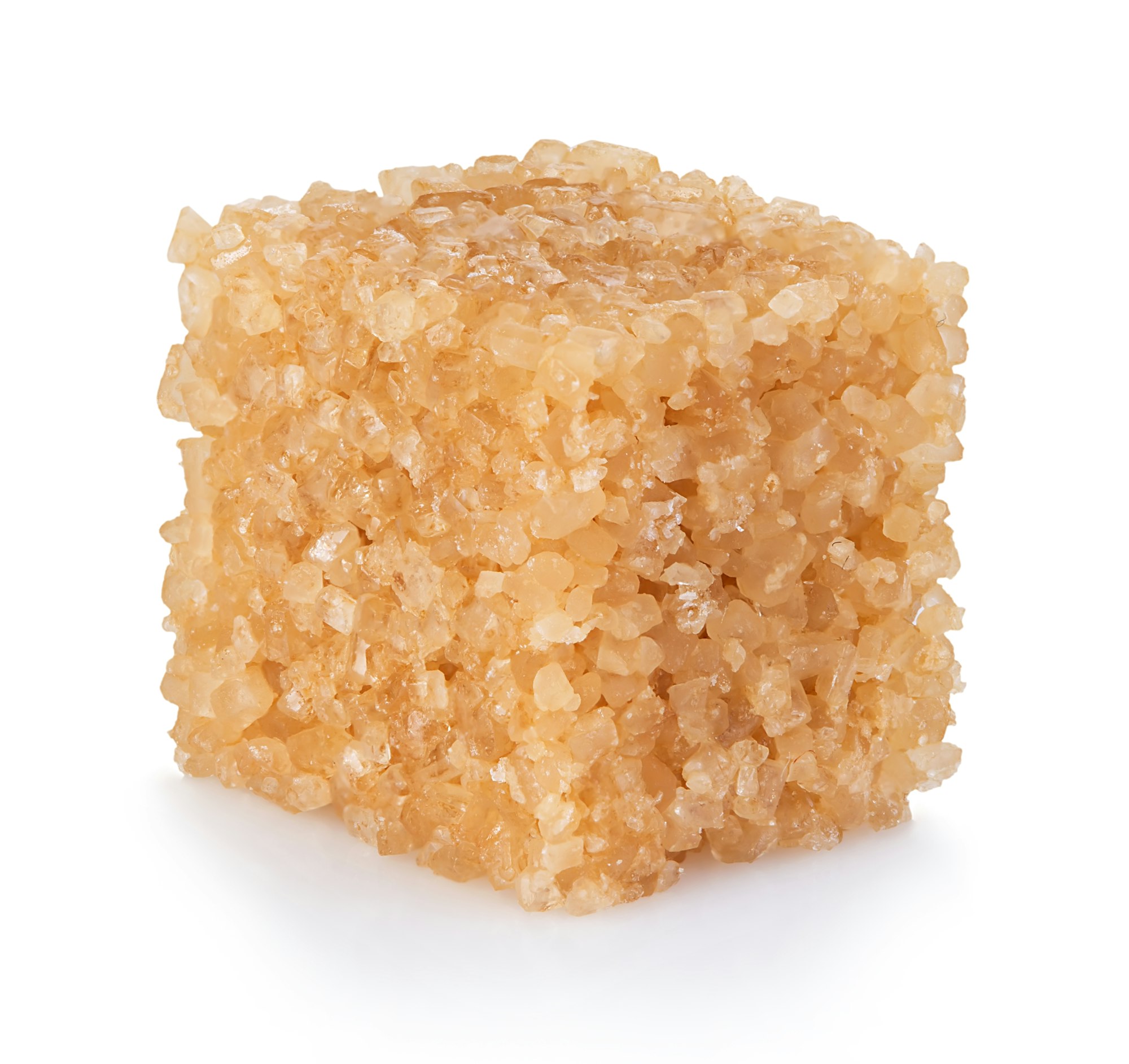 Brown sugar close-up isolated on white background.