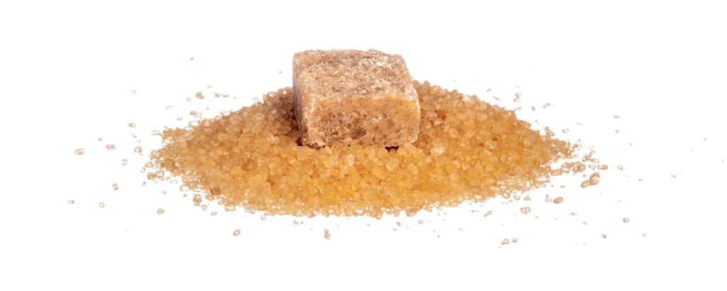 sugar cubes and sugar-sand on a white background